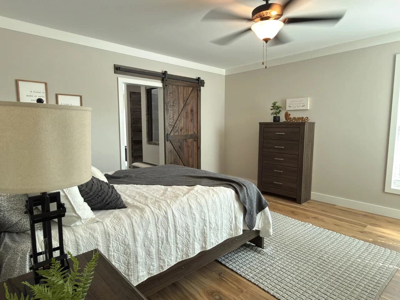 The barndominium bedroom home features