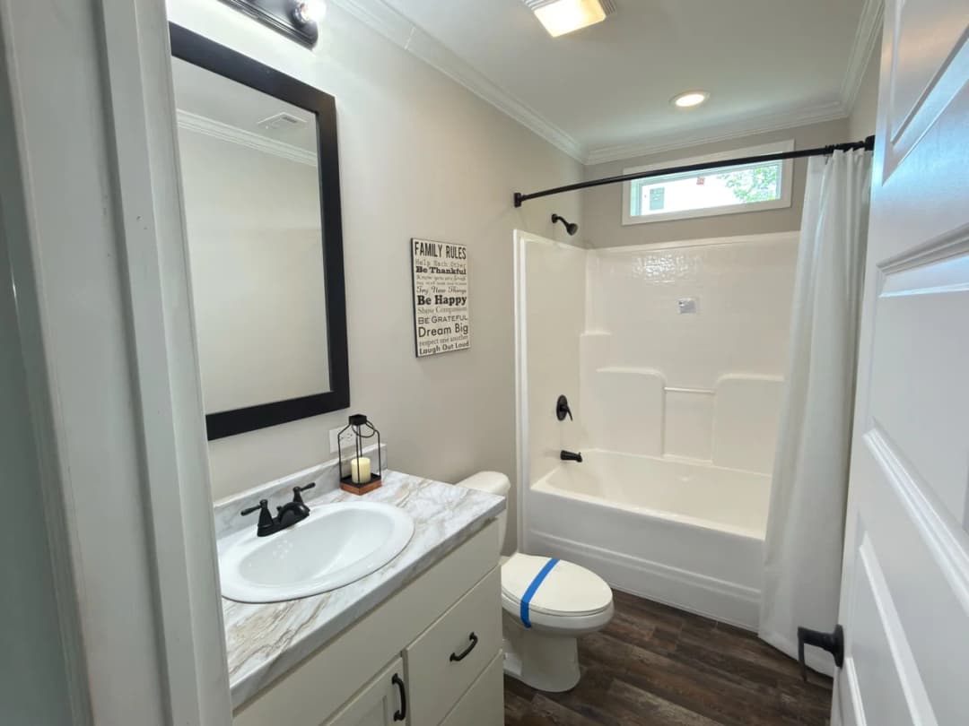 The woodside c bathroom home features