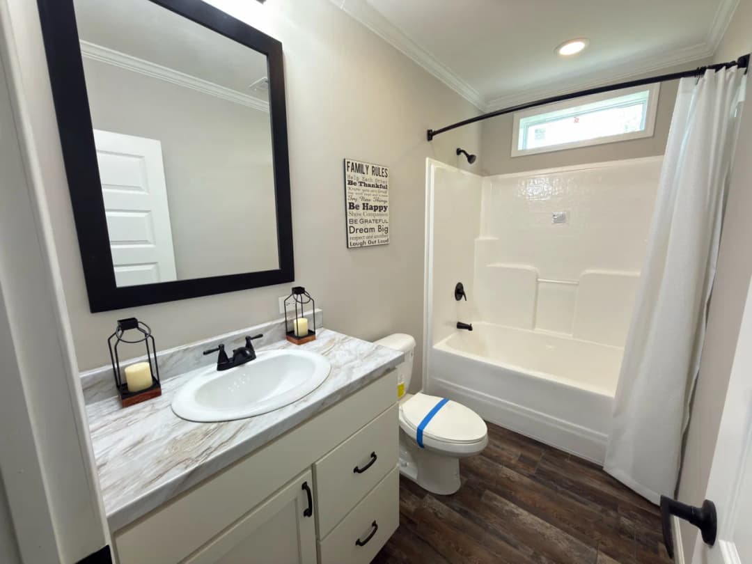 The woodside c bathroom home features